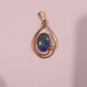 9k gold black opal pendant. Extremely RARE